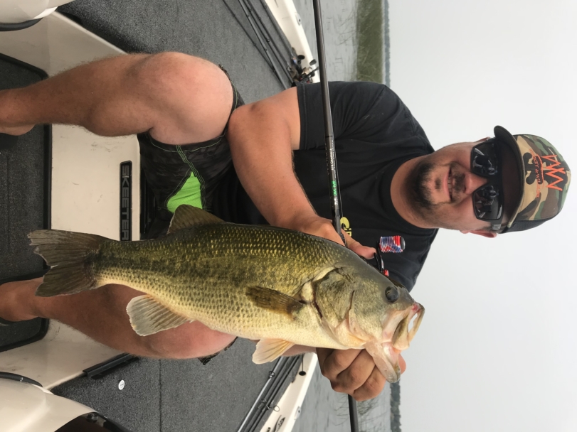 Matt Pasma holding largemouth bass